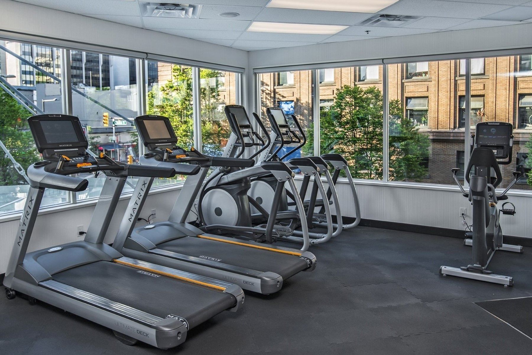 Fitness centre at Chateau Granville with cardiovascular equipment and free weights