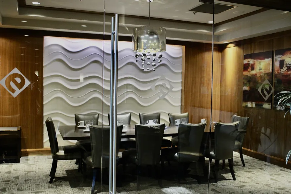 The Cambie Room at Chateau Granville seen from outside its glass wall, a private room set apart from the restaurant floor